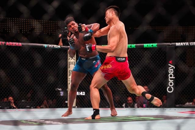 China's light heavyweight fighter Zhang Mingyang (R) punches his opponent US' Alonzo Menifield during their bout at the UFC Fight Night in Galaxy hotel resort, Macau on May 30, 2026. (Photo by Eduardo Leal / AFP)