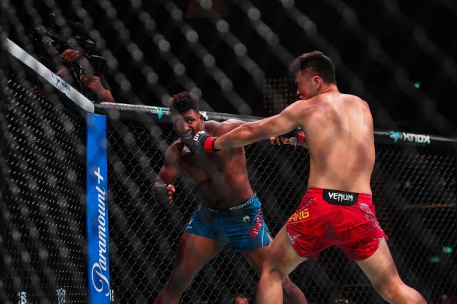 China's light heavyweight fighter Zhang Mingyang (R) punches his opponent US' Alonzo Menifield during their bout at the UFC Fight Night in Galaxy hotel resort, Macau on May 30, 2026. (Photo by Eduardo Leal / AFP)