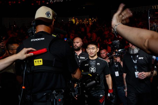 China’s bantamweight fighter Song Yadong (C) arrives for his bout against Brazil’s Deiveson Figueiredo during the UFC Fight Night in Galaxy hotel resort, Macau on May 30, 2026. (Photo by Eduardo Leal / AFP)