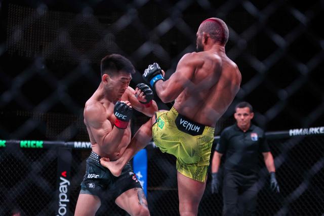 Brazil’s bantamweight fighter Deiveson Figueiredo (R) kicks his opponent China’s Song Yadong during their bout at the UFC Fight Night in Galaxy hotel resort, Macau on May 30, 2026. (Photo by Eduardo Leal / AFP)