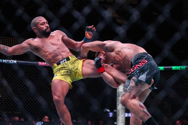 Brazil’s bantamweight fighter Deiveson Figueiredo (L) kicks his opponent China’s Song Yadong during their bout at the UFC Fight Night in Galaxy hotel resort, Macau on May 30, 2026. (Photo by Eduardo Leal / AFP)