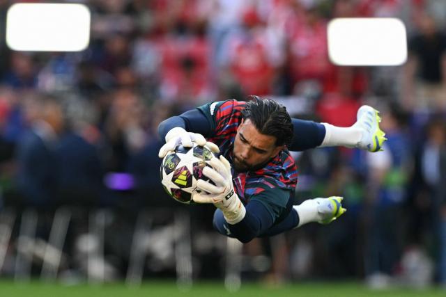 Arsenal's Spanish goalkeeper #01 David Raya warms up prior to the UEFA Champions League final football match between Paris Saint-Germain (PSG) and Arsenal FC at the Puskas Arena in Budapest on May 30, 2026. (Photo by NICOLAS TUCAT / AFP)