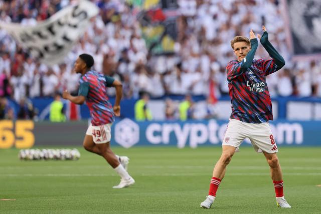 Arsenal's Norwegian midfielder #08 Martin Odegaard applauds the fans before the UEFA Champions League final football match between Paris Saint-Germain (PSG) and Arsenal FC at the Puskas Arena in Budapest on May 30, 2026. (Photo by Odd ANDERSEN / AFP)