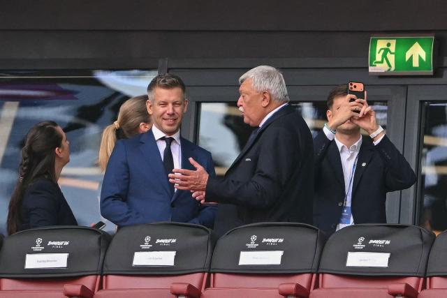 Hungarian Prime Minister Peter Magyar (L) is seen on the stands prior to the UEFA Champions League final football match between Paris Saint-Germain (PSG) and Arsenal FC at the Puskas Arena in Budapest on May 30, 2026. (Photo by NICOLAS TUCAT / AFP)