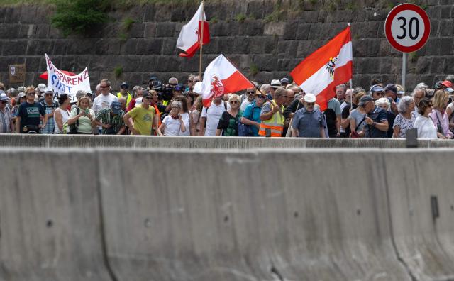 People demonstrate along the A13 Brenner Highway in the direction of Italy during a demonstration and the blockade of the Brenner Base Tunnel against transit traffic near the A13 Brenner Highway in the direction of Italy, on May 30, 2026, on the Tyrolean Brenner Highway. A protest in Austria on May 30 against noise and pollution is set to close one of Europe's most important highways connecting Germany and Italy, potentially causing major traffic disruptions.
Communities in Austria's western Tyrol province have long complained about traffic, especially trucks passing over the Brenner Pass and through the province. (Photo by Joe Klamar / AFP)