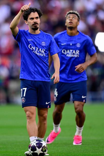 Paris Saint-Germain's Portuguese midfielder #17 Vitinha reacts prior to the UEFA Champions League final football match between Paris Saint-Germain (PSG) and Arsenal FC at the Puskas Arena in Budapest on May 30, 2026. (Photo by INA FASSBENDER / AFP)