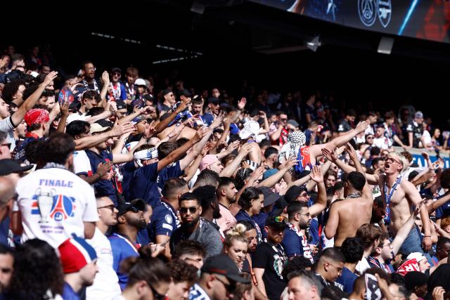 PSG supporters cheer prior to watch on a giant screen the UEFA Champions League final football match between Paris Saint-Germain (PSG) and Arsenal FC played in Budapest, at the Parc des Princes stadium, in Paris on May 30, 2026. (Photo by Kenzo TRIBOUILLARD / AFP)