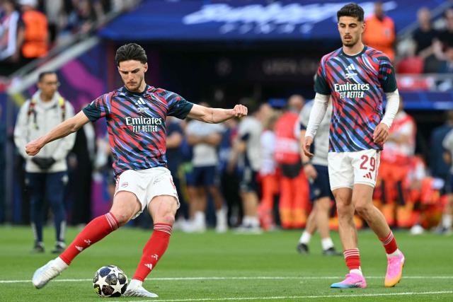 Arsenal's German forward #29 Kai Havertz (R) and Arsenal's English midfielder #41 Declan Rice warm up prior to the UEFA Champions League final football match between Paris Saint-Germain (PSG) and Arsenal FC at the Puskas Arena in Budapest on May 30, 2026. (Photo by NICOLAS TUCAT / AFP)
