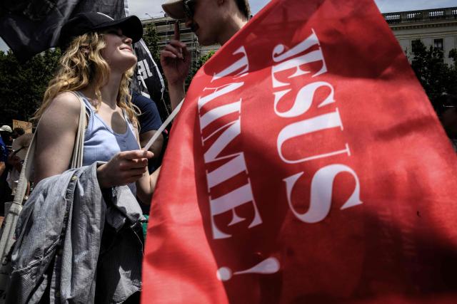 People take part in the "Marche pour Jesus" (March for Jesus) Christian event in Lyon on May 30, 2026. (Photo by Jeff PACHOUD / AFP)