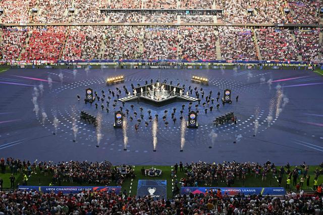 US rock band The Killers perform during the opening ceremony of the UEFA Champions League final football match between Paris Saint-Germain (PSG) and Arsenal FC at the Puskas Arena in Budapest on May 30, 2026. (Photo by Attila KISBENEDEK / AFP)