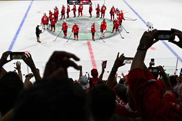 Switzerland's players react after the IIHF Ice Hockey Men's World Championship semi-final match between Switzerland and Norway at the Swiss Life Arena in Zurich, on May 30, 2026. (Photo by Fabrice COFFRINI / AFP)