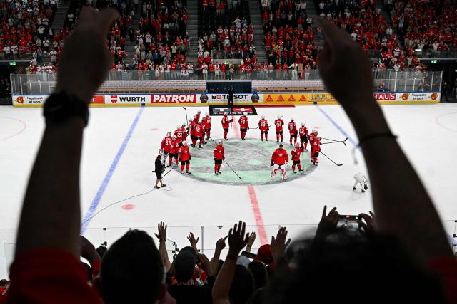 Switzerland's players react after the IIHF Ice Hockey Men's World Championship semi-final match between Switzerland and Norway at the Swiss Life Arena in Zurich, on May 30, 2026. (Photo by Fabrice COFFRINI / AFP)