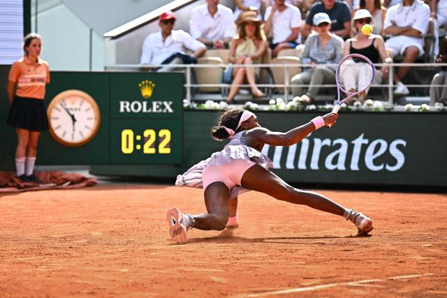 US Coco Gauff falls on the court as she plays a backhand return to Austria's Anastasia Potapova during their women's singles match on day 7 of the French Open tennis tournament on Court Philippe-Chatrier at the Roland-Garros Complex in Paris on May 30, 2026. (Photo by JULIEN DE ROSA / AFP)