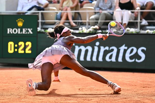 US Coco Gauff falls on the court as she plays a backhand return to Austria's Anastasia Potapova during their women's singles match on day 7 of the French Open tennis tournament on Court Philippe-Chatrier at the Roland-Garros Complex in Paris on May 30, 2026. (Photo by JULIEN DE ROSA / AFP)