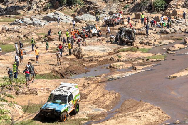 Members of Charging Hippos (car 25) emerge from a rocky river bed as they approach a check point during the Rhino Charge 2026 competition at Ngilai community conservance in Samburu county on May 30, 2026. The Rhino Charge is an annual bush-bashing competition that attracts extreme off-roading enthusiasts who navigate designated sections of uncharted wilderness in specially self-modified vehicles to raise funds for the conservation of Kenya's water towers.Since its inception in 1989, the Rhino Charge has raised over KES 2.6 billion (approximately $20 million USD) that has been used to construct and maintain some 853 kilometres of protective fences around the country's main water catchments that safeguard indigenous forest and certain threatened species residing therein. (Photo by Tony KARUMBA / AFP)