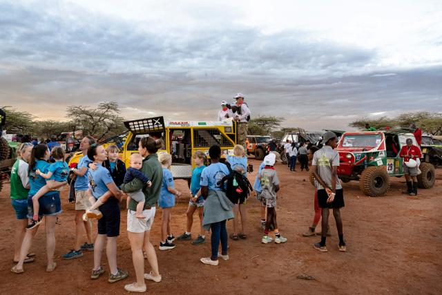 Fans, including relatives of crew's gather to see the start of the Rhino Charge 2026 competition at Ngilai community conservancy in Samburu county on May 30, 2026. The Rhino Charge is an annual bush-bashing competition that attracts extreme off-roading enthusiasts who navigate designated sections of uncharted wilderness in specially self-modified vehicles to raise funds for the conservation of Kenya's water towers.Since its inception in 1989, the Rhino Charge has raised over KES 2.6 billion (approximately $20 million USD) that has been used to construct and maintain some 853 kilometres of protective fences around the country's main water catchments that safeguard indigenous forest and certain threatened species residing therein. (Photo by Tony KARUMBA / AFP)