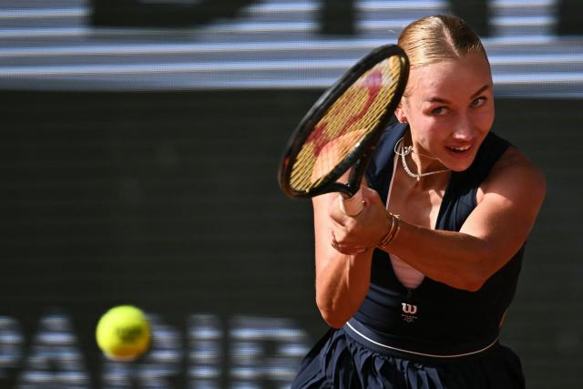 Austria's Anastasia Potapova plays a backhand return to US Coco Gauff during their women's singles match on day 7 of the French Open tennis tournament on Court Philippe-Chatrier at the Roland-Garros Complex in Paris on May 30, 2026. (Photo by JULIEN DE ROSA / AFP)