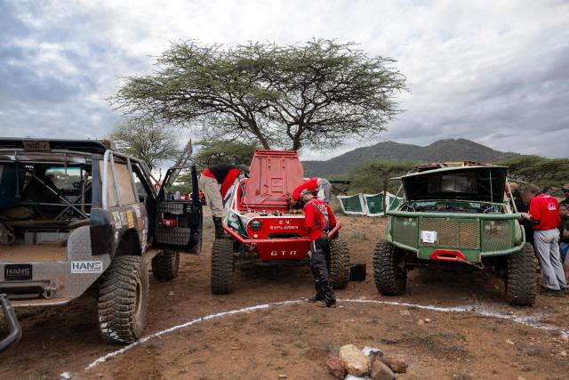 Crew of Team EV Explorers (C) perform final checks on their fully-electric charger at the starting check point of the Rhino Charge 2026 competition at Ngilai community conservancy in Samburu county on May 30, 2026. The Rhino Charge is an annual bush-bashing competition that attracts extreme off-roading enthusiasts who navigate designated sections of uncharted wilderness in specially self-modified vehicles to raise funds for the conservation of Kenya's water towers.Since its inception in 1989, the Rhino Charge has raised over KES 2.6 billion (approximately $20 million USD) that has been used to construct and maintain some 853 kilometres of protective fences around the country's main water catchments that safeguard indigenous forest and certain threatened species residing therein. (Photo by Tony KARUMBA / AFP)