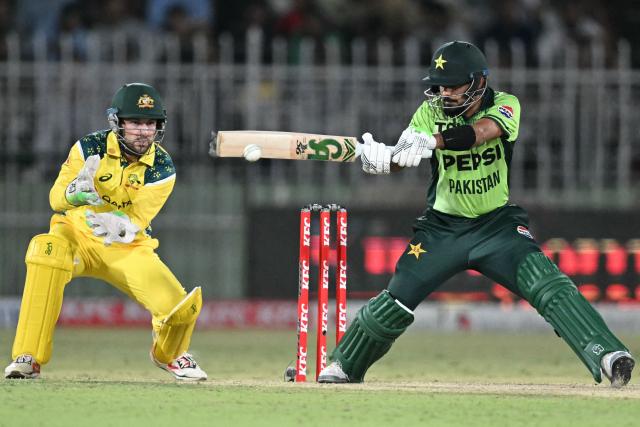 Pakistan's Babar Azam (R) plays a shot during the first one-day international (ODI) cricket match between Pakistan and Australia at the Rawalpindi Cricket Stadium in Rawalpindi on May 30, 2026. (Photo by Aamir QURESHI / AFP)