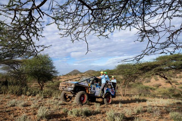 Members of Team Choms navigate their modified Range Rover classic up a wooded hillside as they approach a check point during the Rhino Charge 2026 competition at Ngilai community conservance in Samburu county on May 30, 2026. The Rhino Charge is an annual bush-bashing competition that attracts extreme off-roading enthusiasts who navigate designated sections of uncharted wilderness in specially self-modified vehicles to raise funds for the conservation of Kenya's water towers.Since its inception in 1989, the Rhino Charge has raised over KES 2.6 billion (approximately $20 million USD) that has been used to construct and maintain some 853 kilometres of protective fences around the country's main water catchments that safeguard indigenous forest and certain threatened species residing therein. (Photo by Tony KARUMBA / AFP)