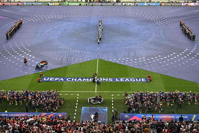 The trophy is displayed during the opening ceremony of the UEFA Champions League final football match between Paris Saint-Germain (PSG) and Arsenal FC at the Puskas Arena in Budapest on May 30, 2026. (Photo by Attila KISBENEDEK / AFP)