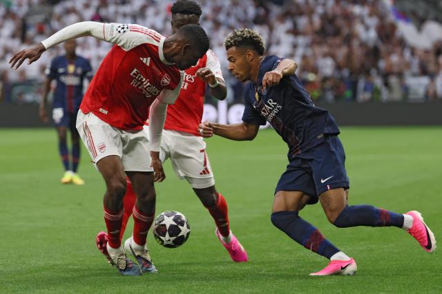 Paris Saint-Germain's French midfielder #14 Desire Doue and Arsenal's Spanish defender #03 Cristhian Mosquera (L) vie for the ball during the UEFA Champions League final football match between Paris Saint-Germain (PSG) and Arsenal FC at the Puskas Arena in Budapest on May 30, 2026. (Photo by Odd ANDERSEN / AFP)