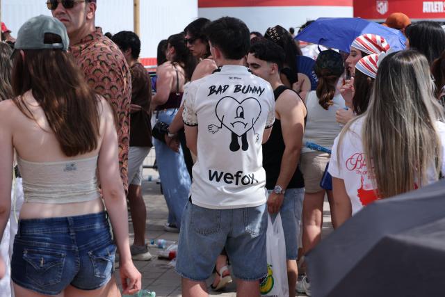 Fans queue outside the Metropolitano stadium ahead of the first Madrid concert of Bad Bunny's 'Debi tirar mas fotos' World Tour later tonight on May 30, 2026. The Puerto Rican superstar kicks off a series of ten concerts in Madrid today, underscoring the Spanish capital’s rapid rise as Europe’s new hub for Latin sounds. Colombian pop superstar Shakira will follow with a 12-night residency beginning September 18 at a temporary venue under construction in southern Madrid that will hold roughly 50,000 people. (Photo by Thomas COEX / AFP)