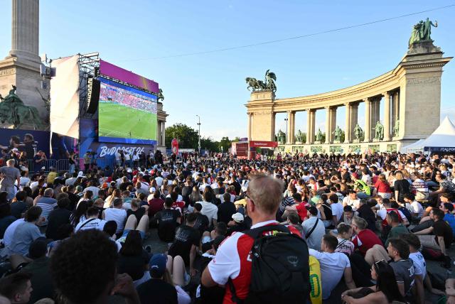 People watch the UEFA Champions League final between Paris Saint-Germain (PSG) and Arsenal FC at the public viewing at Heroes’ Square in Budapest on May 30, 2026 (Photo by JURE MAKOVEC / AFP)