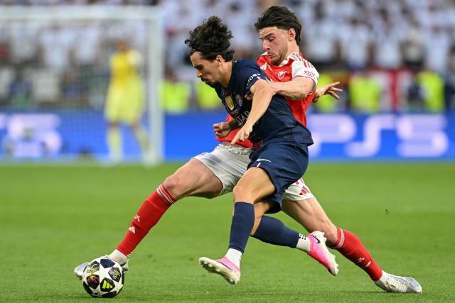 Paris Saint-Germain's Portuguese midfielder #17 Vitinha (front) and Arsenal's English midfielder #41 Declan Rice vie for the ball during the UEFA Champions League final football match between Paris Saint-Germain (PSG) and Arsenal FC at the Puskas Arena in Budapest on May 30, 2026. (Photo by NICOLAS TUCAT / AFP)