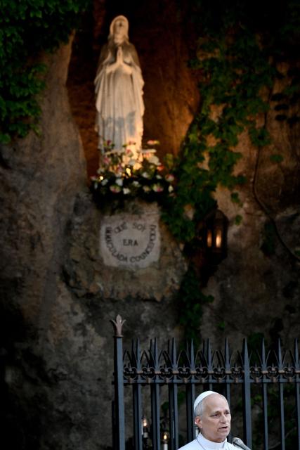 Pope Leo XIV speaks at the replica of the Lourdes Grotto in the Vatican's Gardens during the celebration of a rosary event marking the closing of the Marian month, in The Vatican on May 30, 2026. (Photo by TIZIANA FABI / AFP)