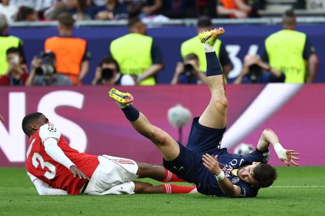 Arsenal's Spanish defender #03 Cristhian Mosquera tackles Paris Saint-Germain's Georgian forward #07 Khvicha Kvaratskhelia (R) inside the box during the UEFA Champions League final football match between Paris Saint-Germain (PSG) and Arsenal FC at the Puskas Arena in Budapest on May 30, 2026. (Photo by FRANCK FIFE / AFP)