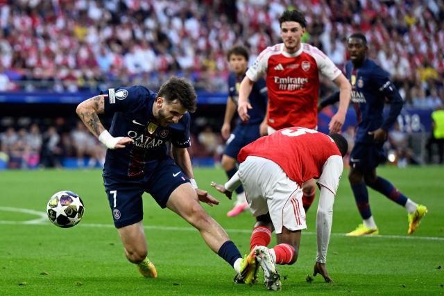 Arsenal's Spanish defender #03 Cristhian Mosquera (R) fouls Paris Saint-Germain's Georgian forward #07 Khvicha Kvaratskhelia during the UEFA Champions League final football match between Paris Saint-Germain (PSG) and Arsenal FC at the Puskas Arena in Budapest on May 30, 2026. (Photo by INA FASSBENDER / AFP)