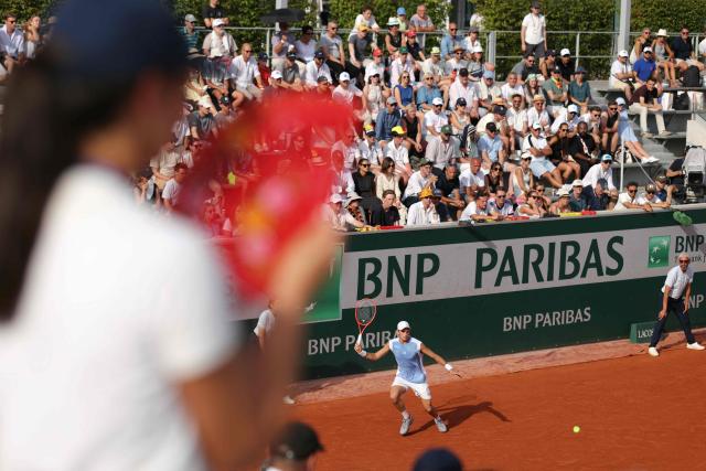 Italy's Matteo Arnaldi plays a forehand return to Belgium's Raphael Collignon during their men's singles match on day 7 of the French Open tennis tournament at the Roland-Garros Complex in Paris on May 30, 2026. (Photo by Thomas SAMSON / AFP)