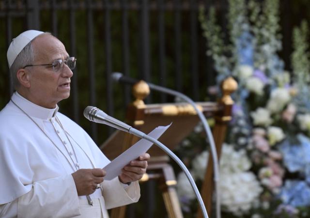 Pope Leo XIV speaks at the replica of the Lourdes Grotto in the Vatican's Gardens during the celebration of a rosary event marking the closing of the Marian month, in The Vatican on May 30, 2026. (Photo by TIZIANA FABI / AFP)