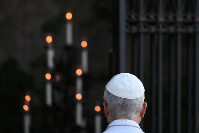 Pope Leo XIV prays at the replica of the Lourdes Grotto in the Vatican's Gardens during the celebration of a rosary event marking the closing of the Marian month, in The Vatican on May 30, 2026. (Photo by TIZIANA FABI / AFP)