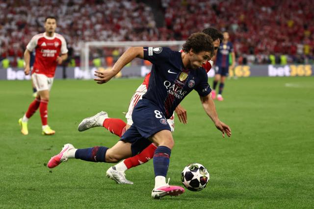 Paris Saint-Germain's Portuguese midfielder #87 Joao Neves and Arsenal's Spanish defender #36 Martin Zubimendi (back) fight for the ball during the UEFA Champions League final football match between Paris Saint-Germain (PSG) and Arsenal FC at the Puskas Arena in Budapest on May 30, 2026. (Photo by FRANCK FIFE / AFP)