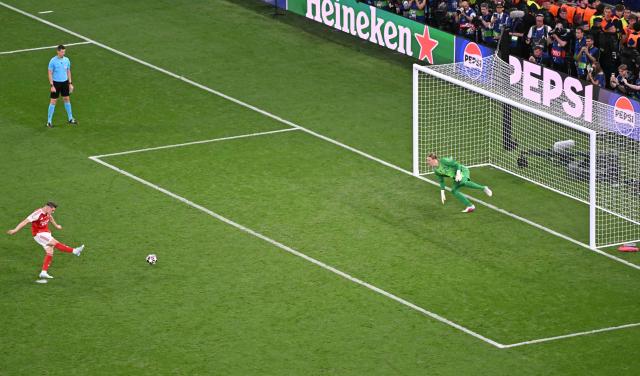 Arsenal's Swedish striker #14 Viktor Gyokeres kicks the ball during the penalty shoot-out in the UEFA Champions League final football match between Paris Saint-Germain (PSG) and Arsenal FC at the Puskas Arena in Budapest on May 30, 2026. (Photo by Attila KISBENEDEK / AFP)