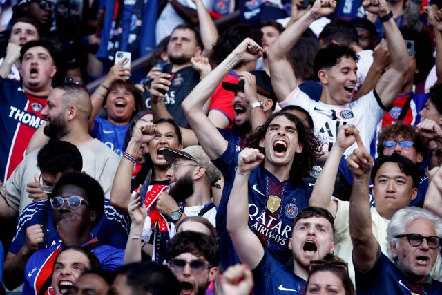 Paris Saint-Germain's supporters react during the UEFA Champions League final football match between Paris Saint-Germain (PSG) and Arsenal FC played in Budapest, displayed on a giant screen at the Parc des Princes stadium fan zone, in Paris on May 30, 2026. (Photo by Kenzo TRIBOUILLARD / AFP)