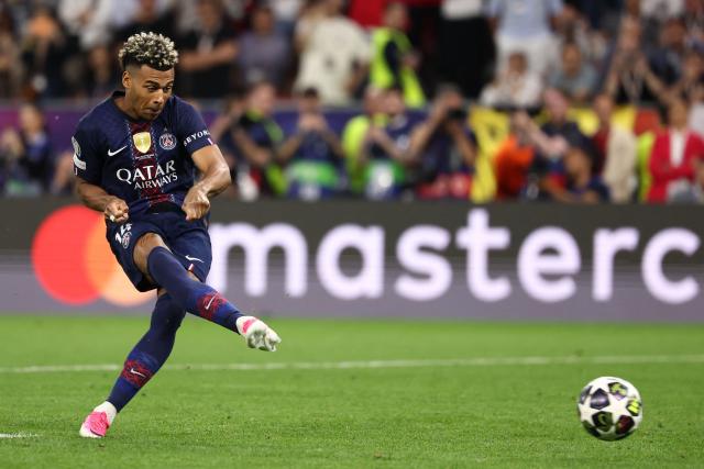 Paris Saint-Germain's French midfielder #14 Desire Doue takes a penalty during the penalty shootout during the UEFA Champions League final football match between Paris Saint-Germain (PSG) and Arsenal FC at the Puskas Arena in Budapest on May 30, 2026. (Photo by FRANCK FIFE / AFP)