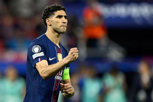 Paris Saint-Germain's Moroccan defender #02 Achraf Hakimi reacts after scoring during penalty shootout during the UEFA Champions League final football match between Paris Saint-Germain (PSG) and Arsenal FC at the Puskas Arena in Budapest on May 30, 2026. (Photo by INA FASSBENDER / AFP)