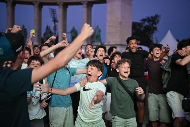 Children celebrate a penalty goal during the UEFA Champions League final between Paris Saint-Germain (PSG) and Arsenal FC at the public viewing in Budapest at the Heroes Square on May 30, 2026 (Photo by JURE MAKOVEC / AFP)