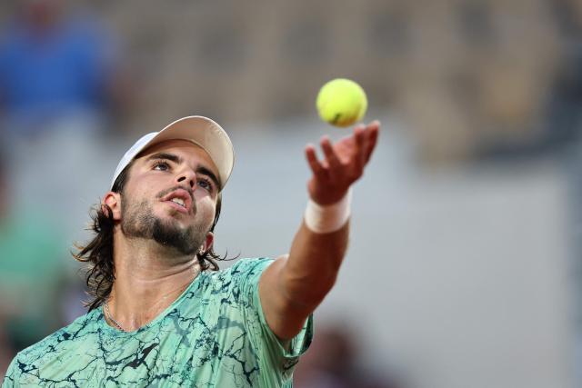 Portugal's Jaime Faria serves to US Frances Tiafoe during their men's singles match on day 7 of the French Open tennis tournament on Court Suzanne-Lenglen at the Roland-Garros Complex in Paris on May 30, 2026. (Photo by Anne-Christine POUJOULAT / AFP)