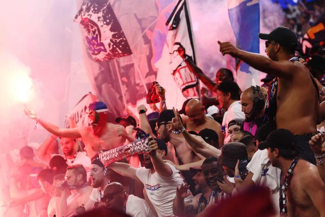 Paris Saint-Germain (PSG) supporters celebrate after winning the UEFA Champions League final football match between Paris Saint-Germain (PSG) and Arsenal FC at the Puskas Arena in Budapest on May 30, 2026. (Photo by FRANCK FIFE / AFP)