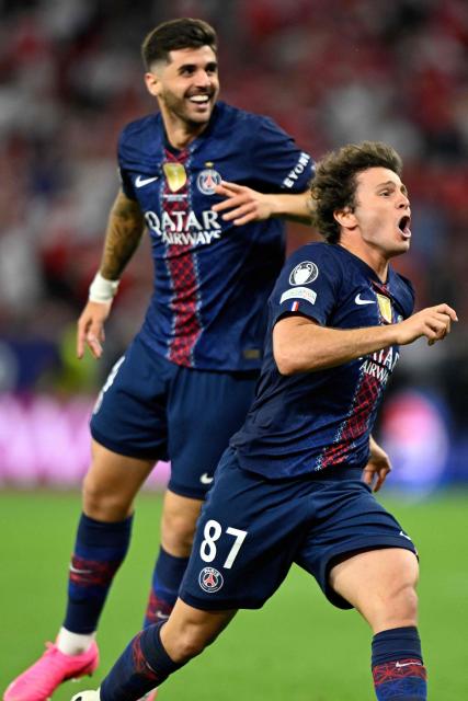 Paris Saint-Germain's Portuguese midfielder #87 Joao Neves (R) and Paris Saint-Germain's Brazilian defender #04 Lucas Beraldo celebrate after winning the UEFA Champions League final football match between Paris Saint-Germain (PSG) and Arsenal FC at the Puskas Arena in Budapest on May 30, 2026. Paris Saint-Germain beat Arsenal 4-3 on penalties to win their second consecutive Champions League title after a 1-1 draw in the final in Budapest on May 30. (Photo by INA FASSBENDER / AFP)