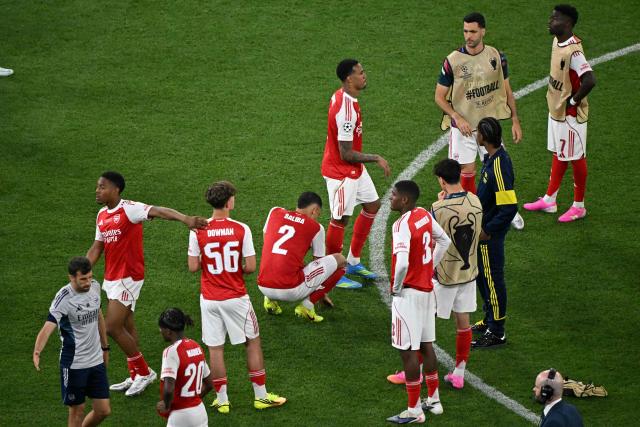 Arsenal players react after loosing the UEFA Champions League final football match between Paris Saint-Germain (PSG) and Arsenal FC at the Puskas Arena in Budapest on May 30, 2026. (Photo by Attila KISBENEDEK / AFP)