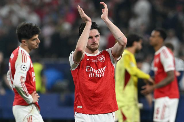 Arsenal's English midfielder #41 Declan Rice and teammates react after the UEFA Champions League final football match between Paris Saint-Germain (PSG) and Arsenal FC at the Puskas Arena in Budapest on May 30, 2026. Paris Saint-Germain beat Arsenal 4-3 on penalties to win their second consecutive Champions League title after a 1-1 draw in the final in Budapest on May 30. (Photo by NICOLAS TUCAT / AFP)