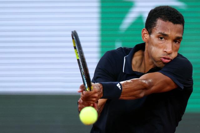 Canada's Felix Auger-Aliassime plays a backhand return to US Brandon Nakashima during their men's singles match on day 7 of the French Open tennis tournament on Court Philippe-Chatrier at the Roland-Garros Complex in Paris on May 30, 2026. (Photo by ALAIN JOCARD / AFP)