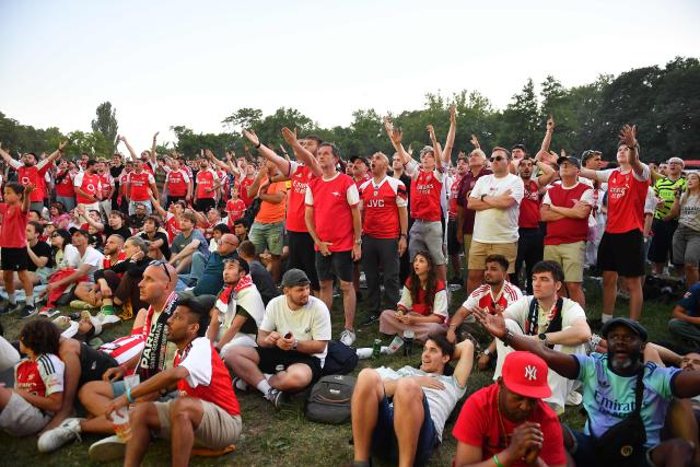 Arsenal supporters react in a fan zone during the UEFA Champions League final football match between Paris Saint-Germain (PSG) and Arsenal FC in Budapest on May 30, 2026. (Photo by Ferenc ISZA / AFP)