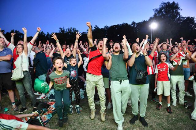 Arsenal supporters react in a fan zone during the penalty shoot out of the UEFA Champions League final football match between Paris Saint-Germain (PSG) and Arsenal FC in Budapest on May 30, 2026. (Photo by Ferenc ISZA / AFP)