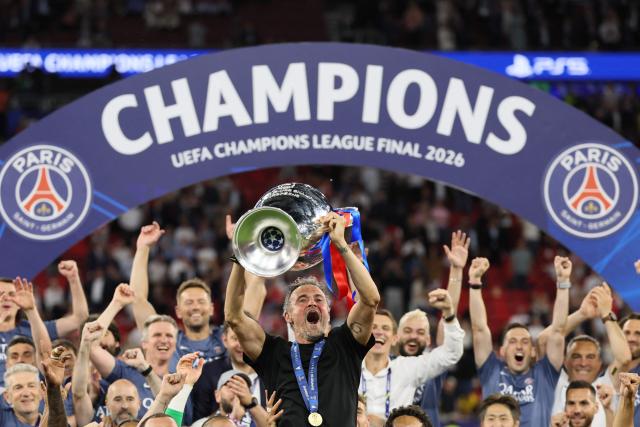 Paris Saint-Germain's Spanish head coach Luis Enrique lifts the trophy after winning the UEFA Champions League final football match between Paris Saint-Germain (PSG) and Arsenal FC at the Puskas Arena in Budapest on May 30, 2026. (Photo by Odd ANDERSEN / AFP)